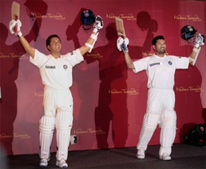 Master blaster next to his wax statue