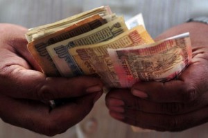 India's rupee skids to new record low against dollar.