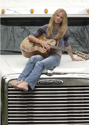 Before covers of fashion mags came along, Swift posed with her trusty guitar on a truck.